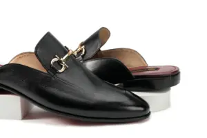 Black Leather Horsebit Mule — three-quarter view