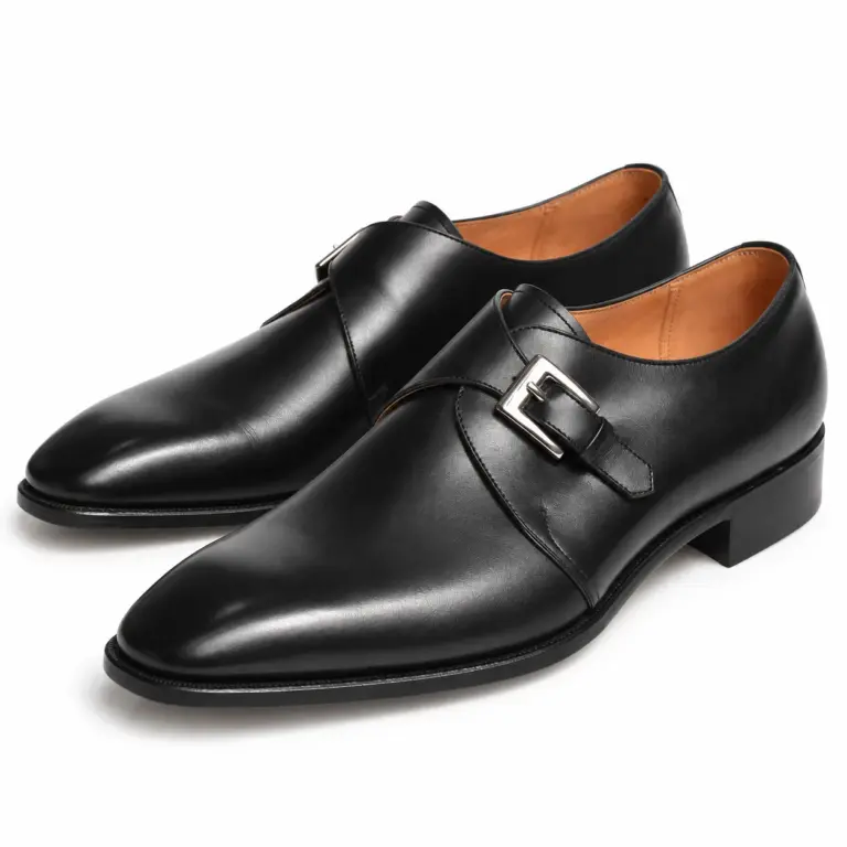 Black leather single monk strap dress shoes for men, pair view