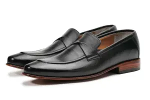Pair of black leather swirl-strap loafers with stitched apron toes