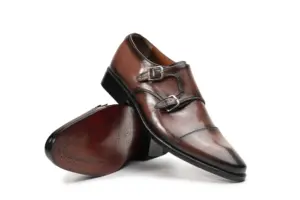 Brown burnished double monk strap shoes by Handsole showing two-buckle closure