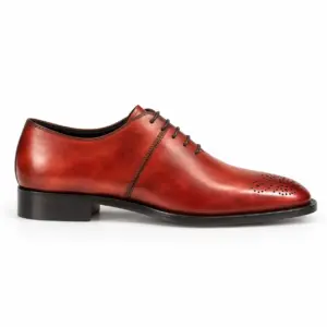 Side profile of the burgundy almond-toe Oxford showing closed lacing, stitched panel seam and toe medallion