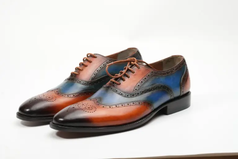 Pair of cognac and blue patina full brogue wingtip Oxford shoes