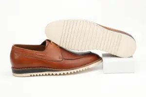 Cognac brown casual Derby with cream ridged outsole shown from the sole side
