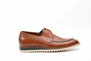 Side profile of cognac brown casual Derby shoe with cream ridged sole