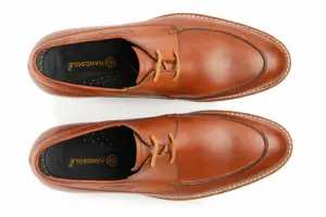 Top view of cognac brown apron-toe casual Derby shoes with Handsole insoles