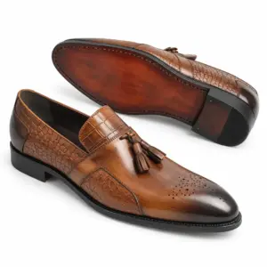 Cognac croc-embossed tassel loafer for men, leather sole view