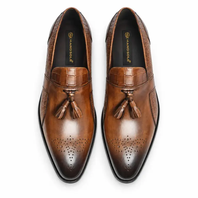 Cognac croc-embossed tassel loafers for men, top view