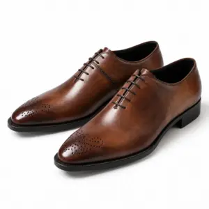 Pair of dark brown almond-toe Oxford dress shoes with perforated toe medallions
