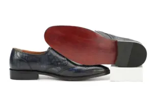 Grey-black single monk strap shoe showing its red-brown finished outsole