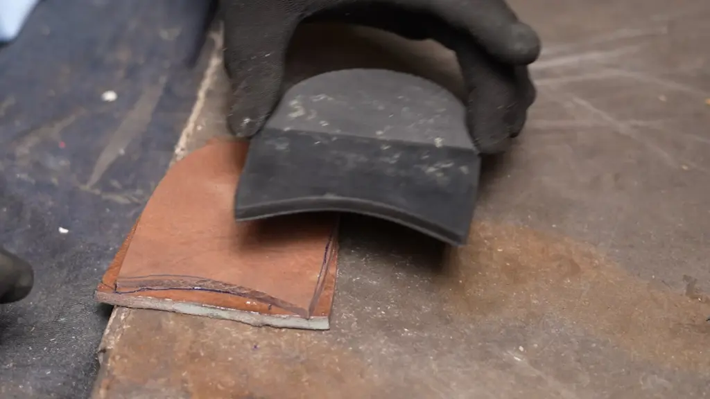 Hand welting technique — craftsman stitching welt by awl through leather upper and insole