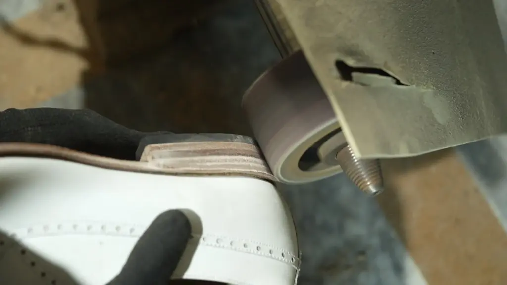 Hand-dyed leather patina — artisan applying Italian penetrating dye to handmade shoes