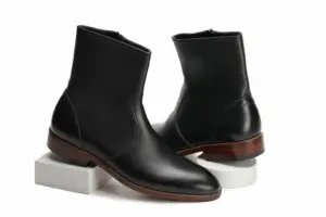 Men's black leather ankle boots from rear three-quarter angle