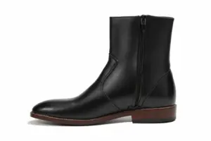 Men's black leather ankle boots showing inside side zipper