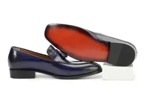 Purple-black tassel loafer and its red-brown finished outsole