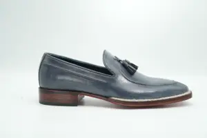 Opposite side of the grey leather tassel loafer showing apron stitching and contrasting welt