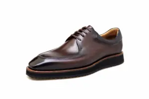 Brown hand-painted apron-toe Derby shoe side view with brown welt and ridged rubber sole