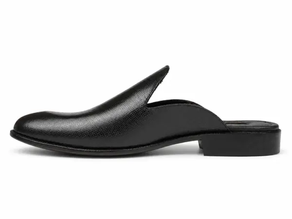 Side profile of a black fine-texture plain mule with an almond toe and open heel
