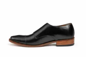 Opposite profile of black cap-toe double monk strap shoe