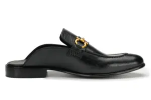 Black leather open-back mule with decorative buckle, front view