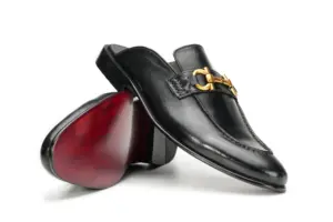 Black leather open-back mule with decorative buckle, rear view