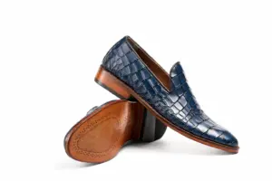 Blue croc-pattern loafer above branded brown leather outsole