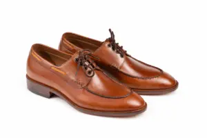 Brown apron toe Derby shoes with leather-laced collar, three-quarter view
