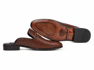 Brown-black horsebit mule side profile and brown leather outsole