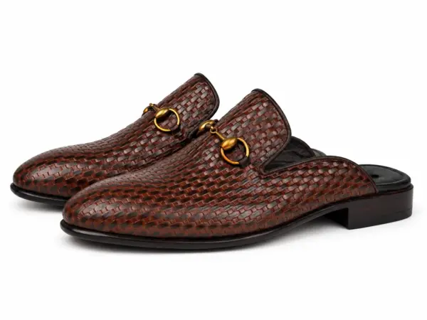 Pair of brown-black basket-pattern mules with gold-tone horsebits
