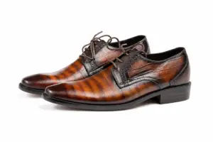 Brown-Black Striped Patina Plain-Toe Derby: pair showing Brown-Black Striped Patina and elongated softly tapered forepart.