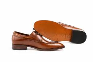 Leather sole and stacked heel with rubber heel top on a brown hand-welted Derby