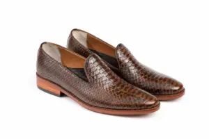 Brown Lizard-Pattern Almond-Toe Wholecut Loafer: three quarter pair showing Brown Lizard-Pattern and refined elongated almond forepart.