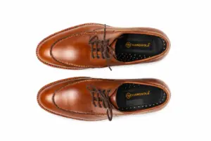 Top view of brown moc toe Derby shoes with round toe and Handsole footbed