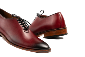 Close view of oxblood wholecut Oxford uppers showing smooth leather and black burnishing