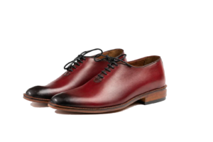 Three-quarter pair of oxblood wholecut Oxfords with black burnished toes and brown sole edges