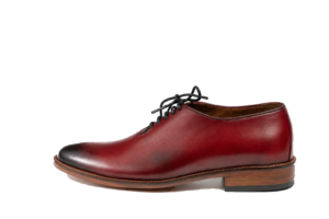 Right side profile of an oxblood wholecut Oxford with brown sole edge and layered heel