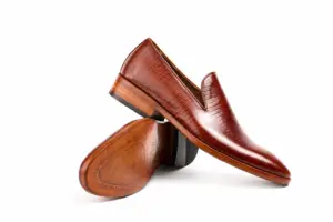 Burgundy Fine-Texture Wholecut Loafer: angled sole showing the brown outsole and dark heel.