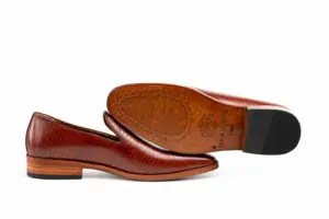 Burgundy Fine-Texture Wholecut Loafer: leather sole profile showing the brown outsole and dark heel.