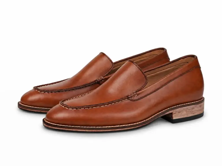 Cognac apron-toe leather loafers with contact shadows