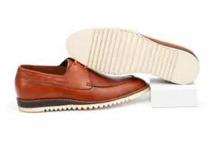 White ridged Vibram rubber sole on a cognac casual Derby shoe for men