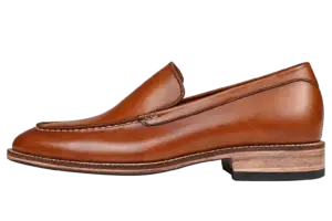 Side profile of a cognac pull-up leather apron-toe loafer