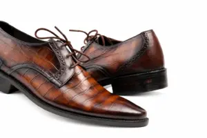 Handmade brown croc-embossed cow leather dress shoes for men showing open lacing and hand-painted two-tone patina