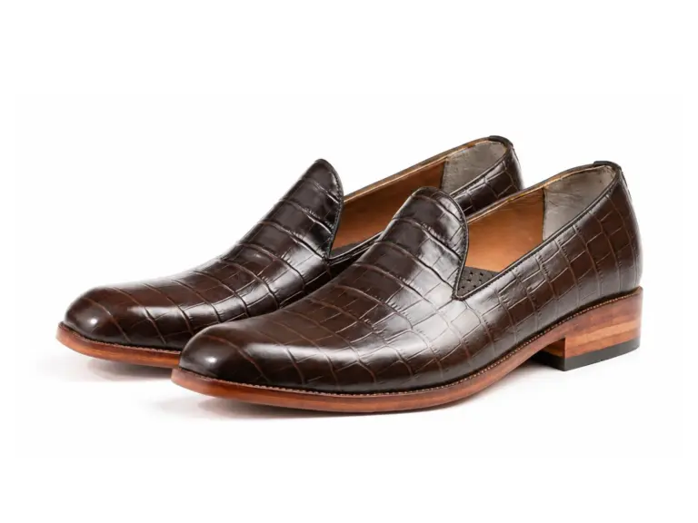 Pair of dark brown croc-pattern square-toe wholecut loafers