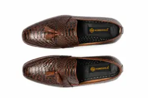 Alternate overhead view of dark brown textured tassel loafers with almond-shaped foreparts