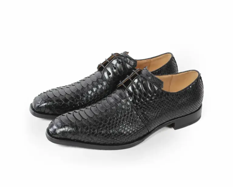 Pair of black python leather plain-toe Derby shoes with open lacing and natural python scales