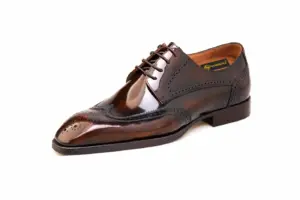 Men's brown patent leather longwing brogue Derby shoe, side view
