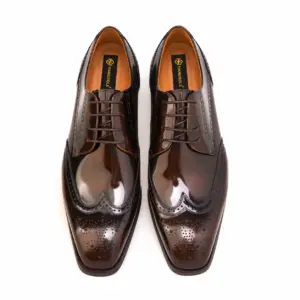Overhead view of men's brown patent longwing brogue Derby shoes with Handsole insoles