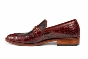Alternate side view of burgundy reptile-pattern horsebit loafer showing the leather finish and heel proportions