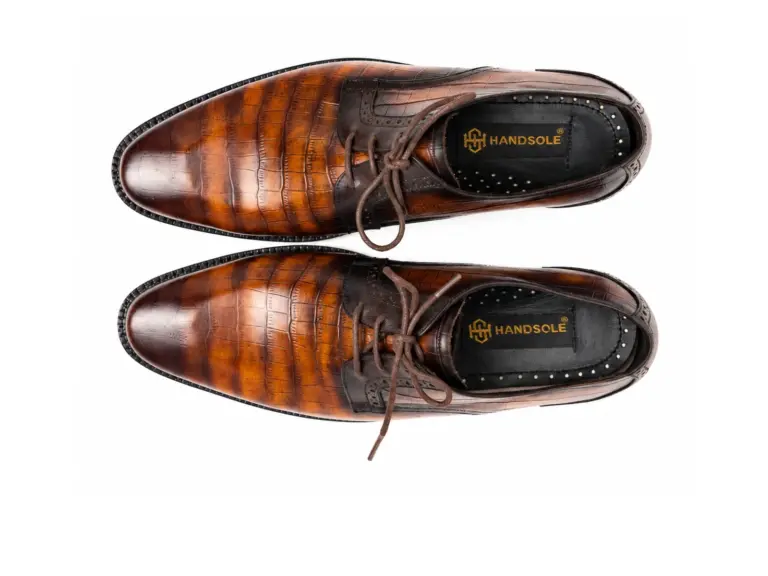 Men's tan croc embossed Derby shoes with amber to dark chocolate antique patina, overhead view