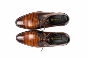 Men's tan croc embossed Derby shoes with amber to dark chocolate antique patina, overhead view