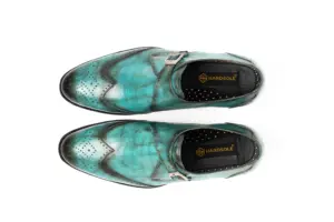 Overhead view of turquoise patina wingtip single monk strap shoes showing the vamps and HANDSOLE-branded footbeds